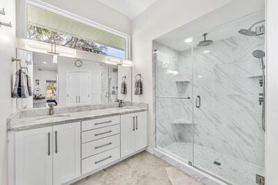 bathroom featuring vanity and walk in shower