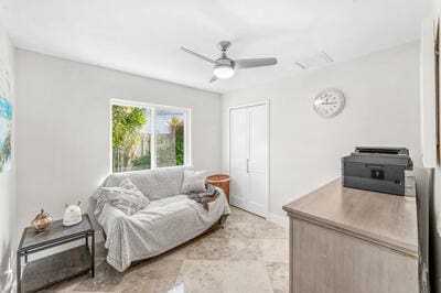 living room featuring ceiling fan