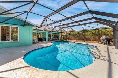 view of pool with a lanai and a patio area