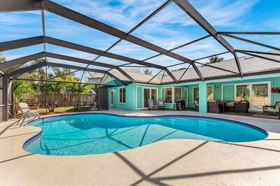 view of swimming pool with glass enclosure, a patio area, and an outdoor hangout area