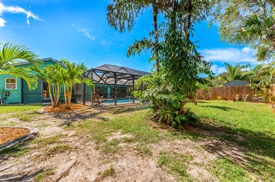 view of yard with a lanai