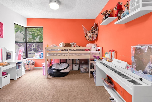 bedroom with carpet flooring and a textured ceiling