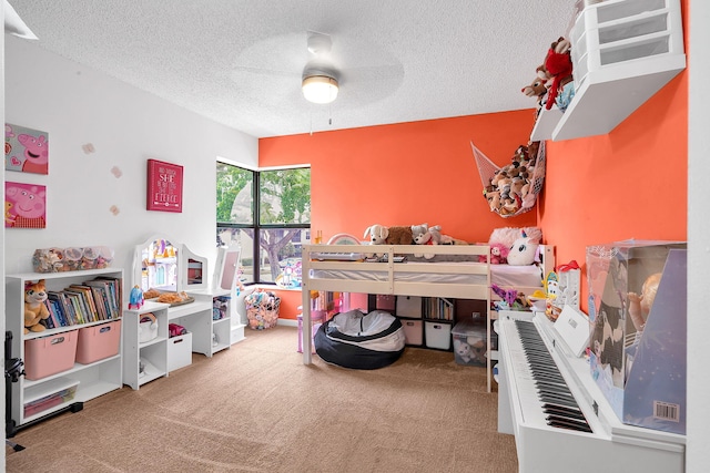 carpeted bedroom with a textured ceiling and ceiling fan