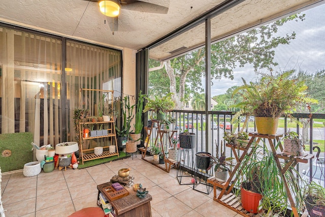 sunroom featuring ceiling fan