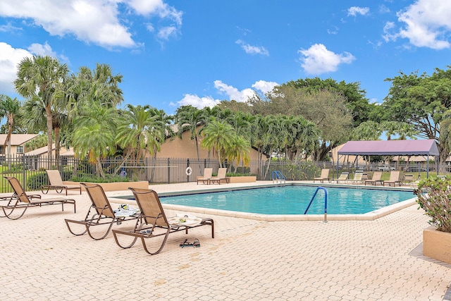 view of swimming pool featuring a patio area