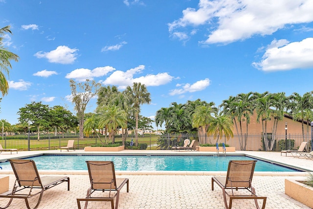 view of swimming pool with a patio area