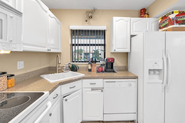 kitchen featuring white cabinetry, white appliances, and sink