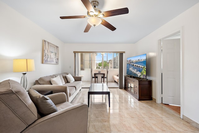 tiled living room with ceiling fan