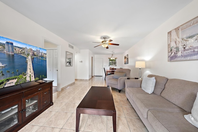 living room with light tile patterned floors and ceiling fan