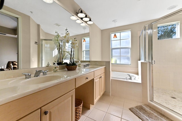 bathroom featuring vanity, tile patterned flooring, and plus walk in shower