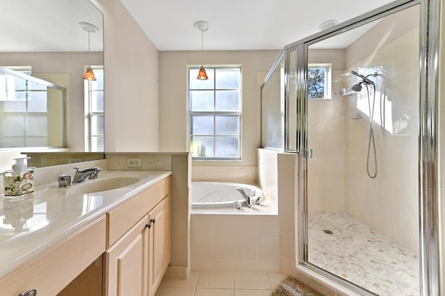 bathroom with tile patterned flooring, vanity, and independent shower and bath