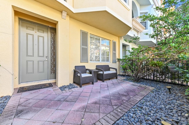 doorway to property with a patio area