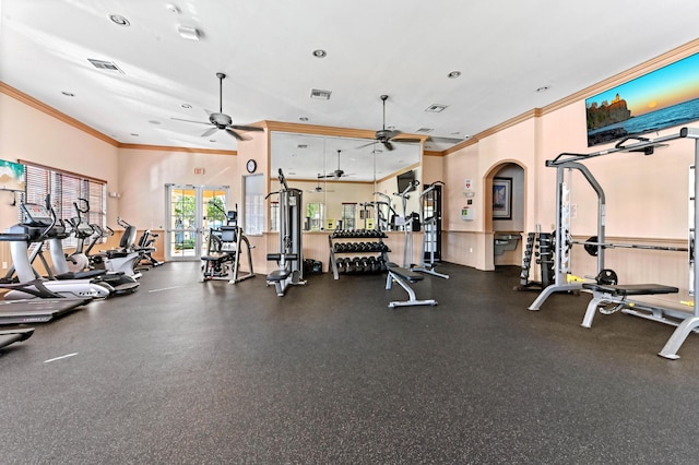 exercise room with ceiling fan and crown molding