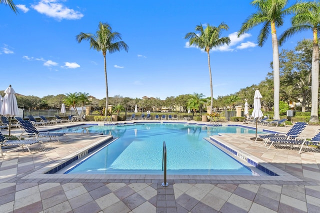 view of swimming pool with a patio