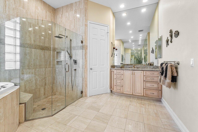 bathroom with tile patterned flooring, vanity, and a shower with shower door