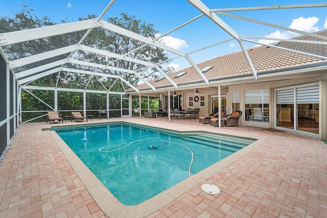 view of pool featuring a lanai, a patio area, and outdoor lounge area