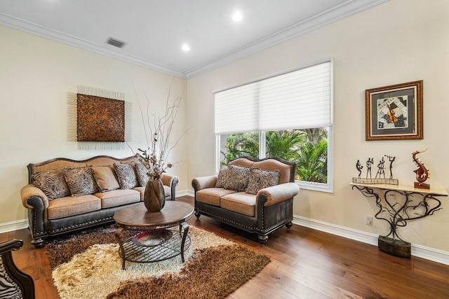 living room featuring dark hardwood / wood-style flooring and ornamental molding