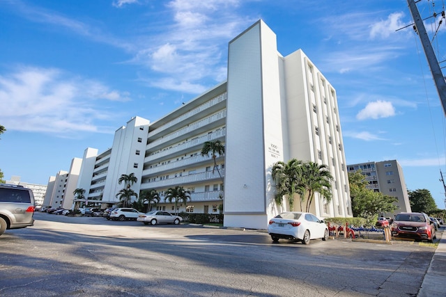 1000 NE 12th Ave Unit 304, Hallandale Beach, FL 33009 - view of building exterior featuring uncovered parking