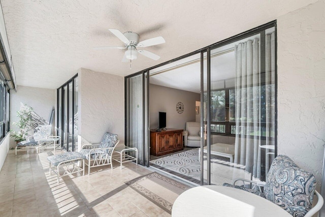 balcony featuring ceiling fan and a patio area