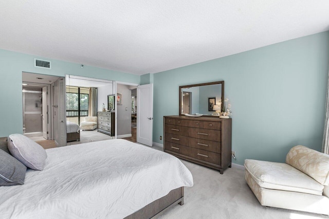 carpeted bedroom with a textured ceiling