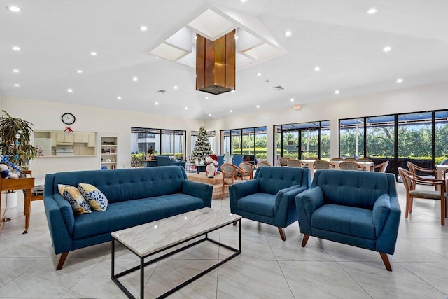 dining area featuring ceiling fan and high vaulted ceiling