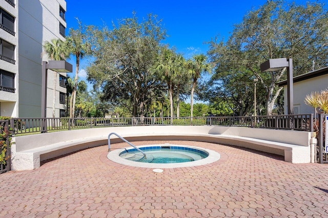 view of swimming pool featuring a community hot tub