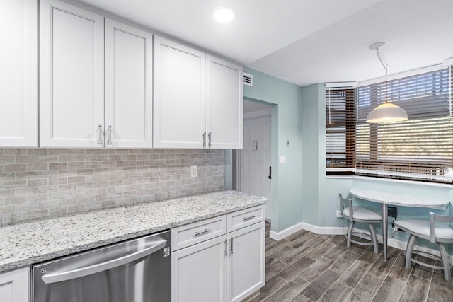 kitchen with white cabinetry, hanging light fixtures, dark wood-type flooring, tasteful backsplash, and stainless steel dishwasher