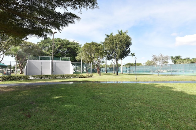 view of yard with tennis court