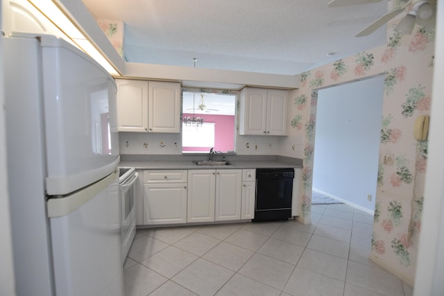 kitchen with white cabinets, white appliances, sink, and light tile patterned floors