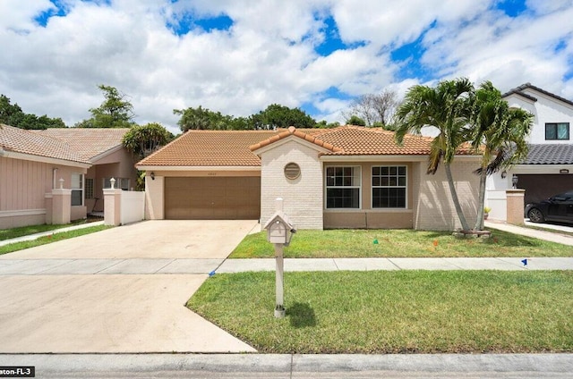 mediterranean / spanish-style home with a front lawn and a garage