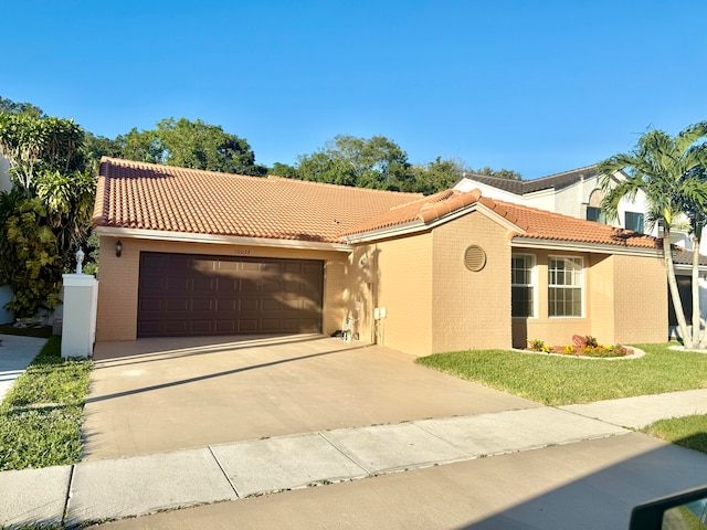 mediterranean / spanish home featuring a garage