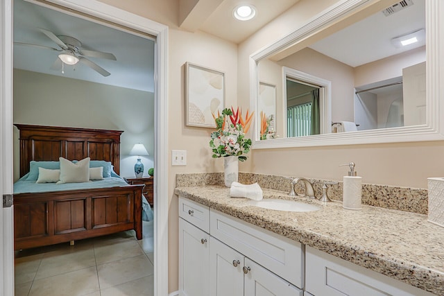 bathroom featuring vanity, tile patterned floors, and ceiling fan