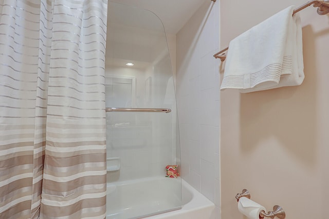 bathroom with shower / tub combo with curtain