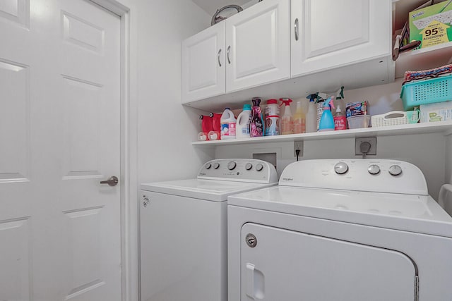 laundry room with cabinets and independent washer and dryer