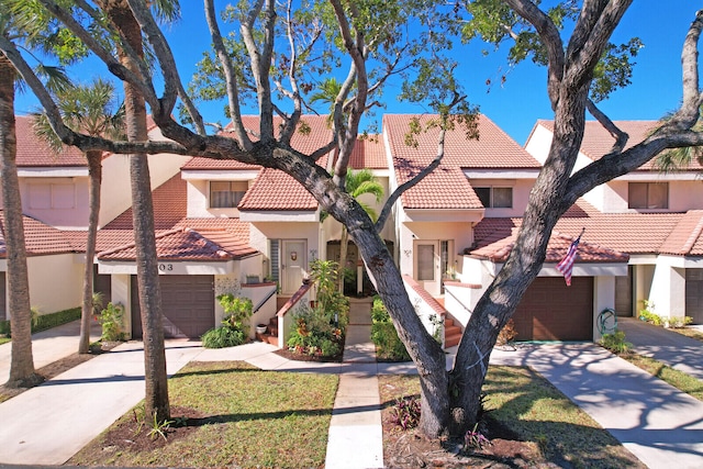 mediterranean / spanish-style house featuring a garage