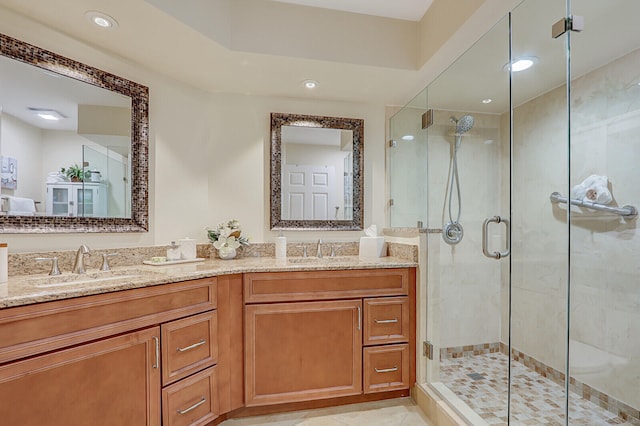 bathroom with tile patterned flooring, vanity, and an enclosed shower