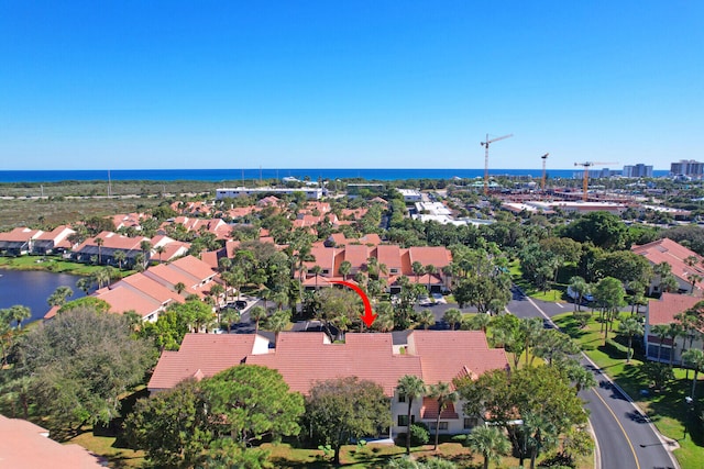 birds eye view of property featuring a water view