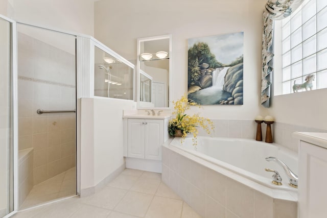 bathroom featuring tile patterned flooring, separate shower and tub, and vanity