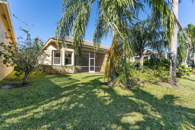 view of yard with a sunroom