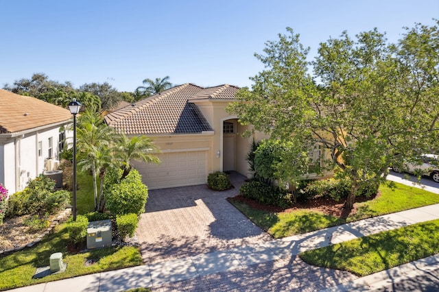 mediterranean / spanish-style house featuring a garage