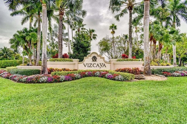 community / neighborhood sign with a lawn