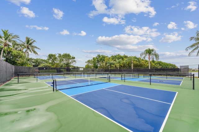 view of tennis court featuring basketball hoop