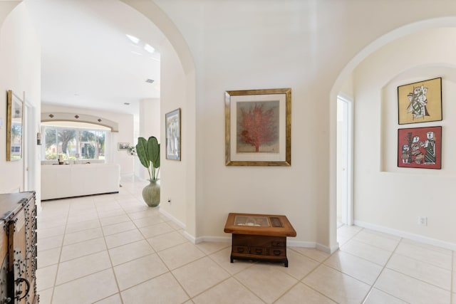 hall featuring light tile patterned floors