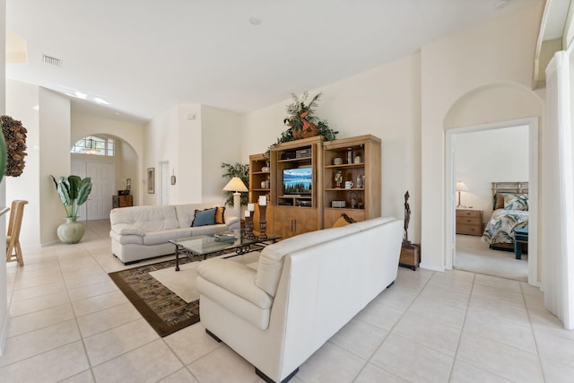 living room with light tile patterned flooring