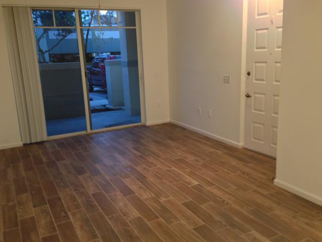 spare room with dark wood-type flooring