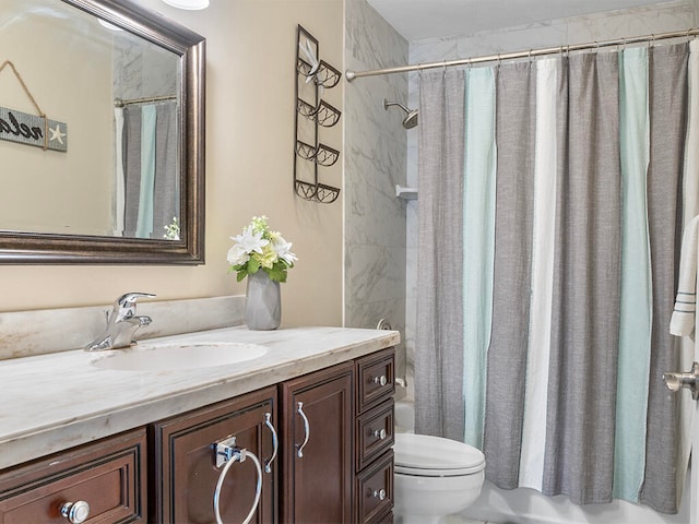 full bathroom featuring shower / bath combo, vanity, and toilet