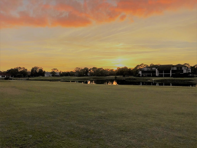 yard at dusk with a water view