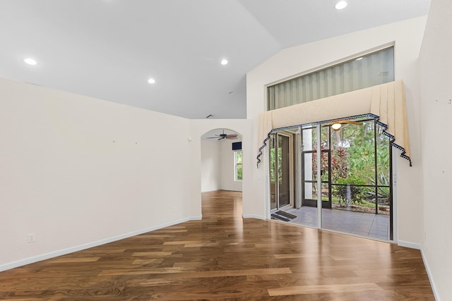 unfurnished room featuring hardwood / wood-style flooring, ceiling fan, and high vaulted ceiling