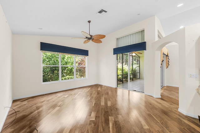 spare room featuring ceiling fan, light hardwood / wood-style flooring, and vaulted ceiling