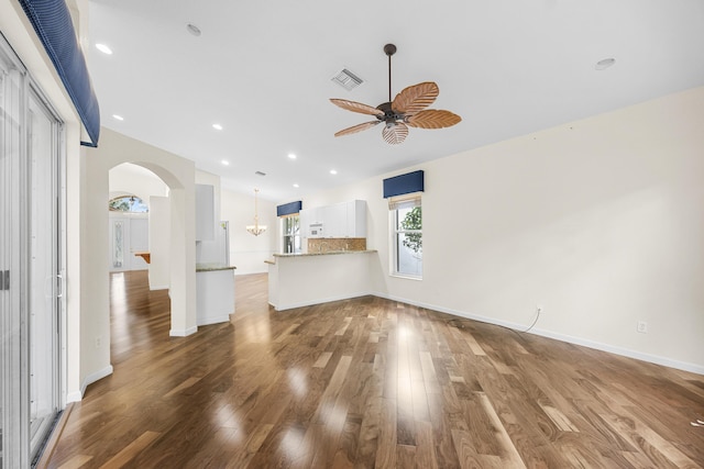 unfurnished living room with hardwood / wood-style flooring and ceiling fan